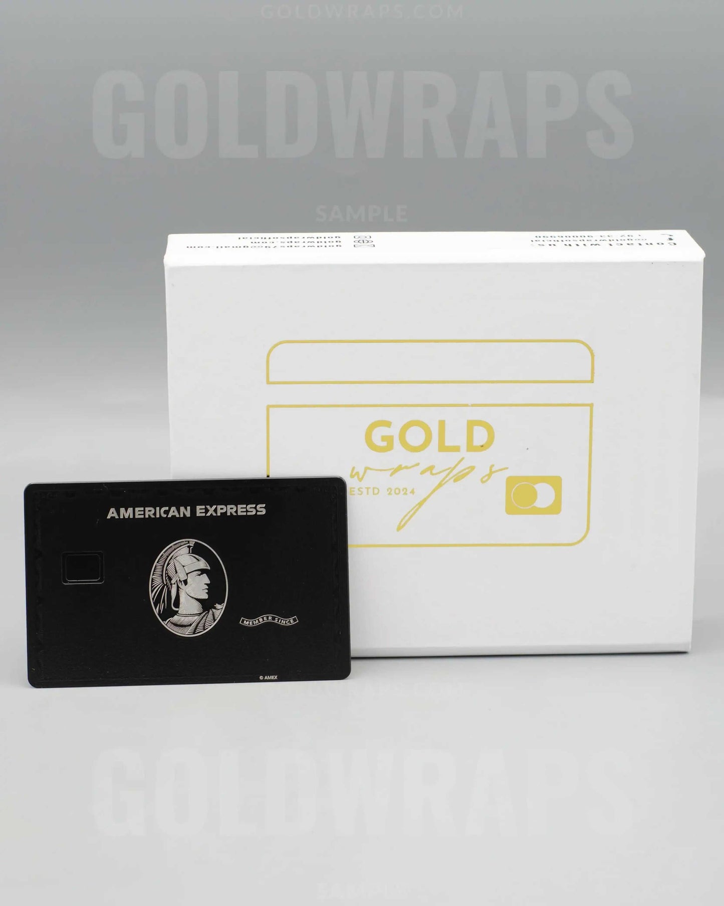 Black AMX metal card with Gold Wraps premium packaging box
