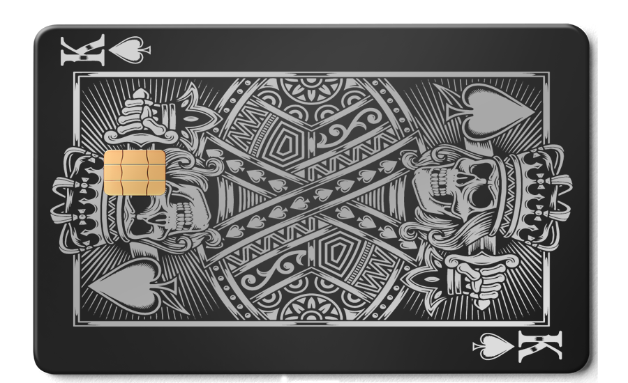 Black metal card featuring King of Spades skull design and integrated chip