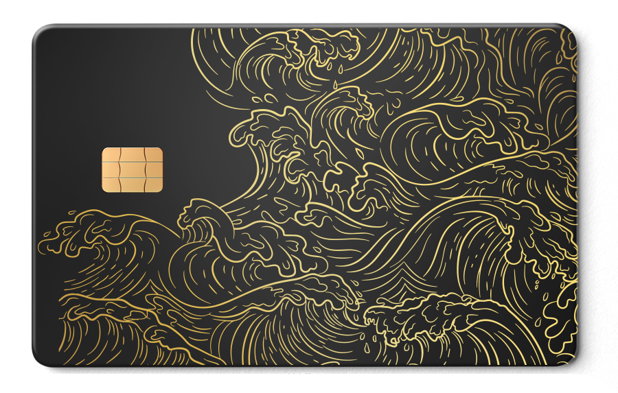 Metal card with gold wave pattern and EMV chip on matte black background