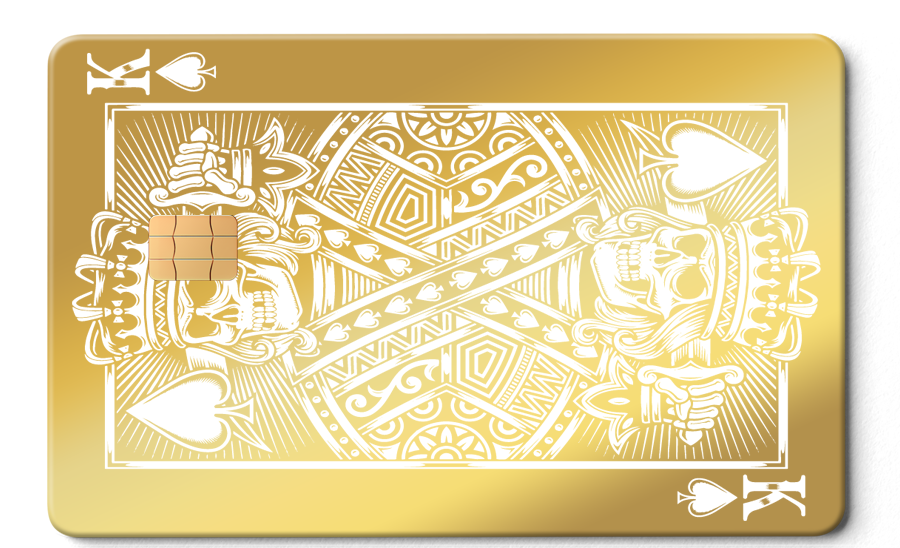 Gold metal card with King of Spades, skull design, white details, and EMV chip.