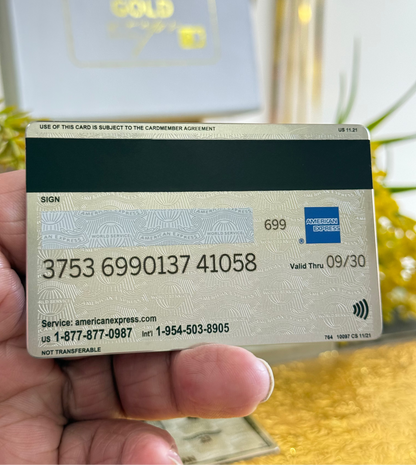 backside of platinum amex metal card by gold wraps