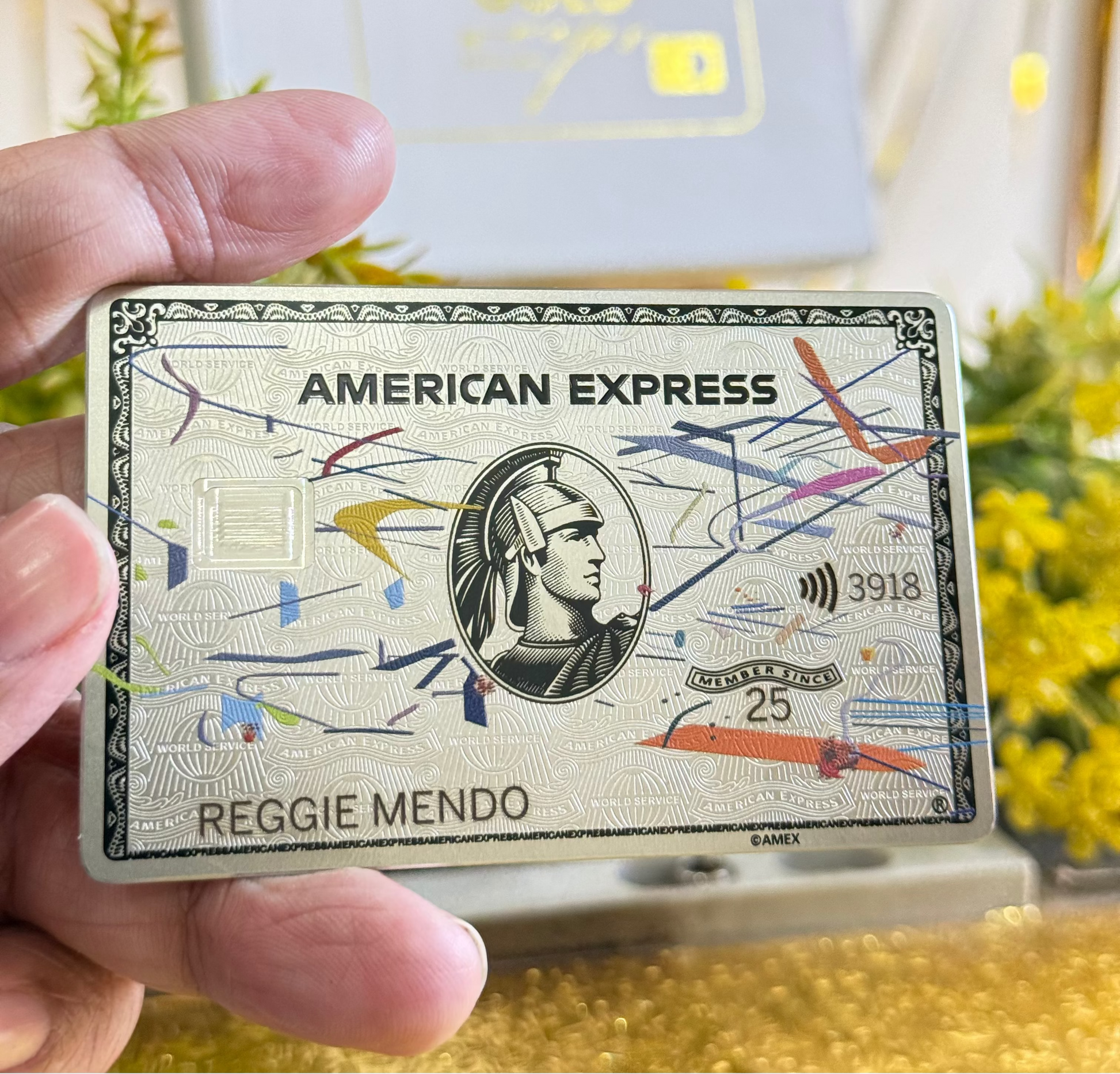 Limited Edition Line Art American Express card held by a hand with a blurred background