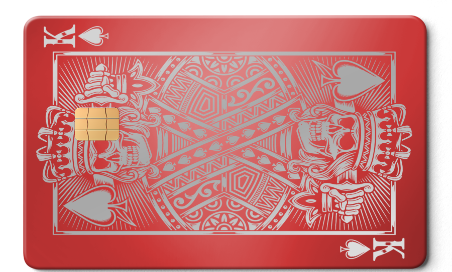 Red metal card with King of Spades skull design and embedded chip