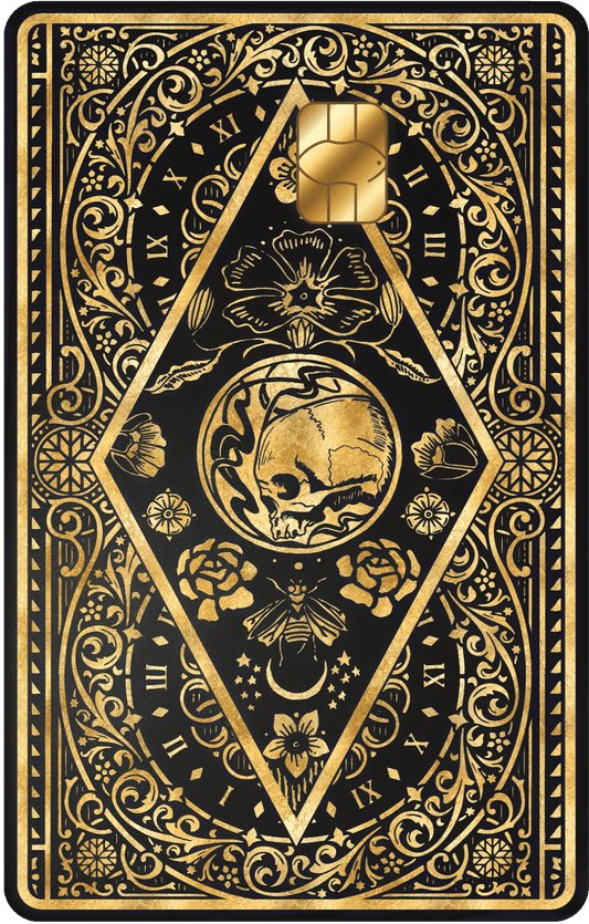 Metal card with ornate gold skull, clock, floral, and bee design on black background