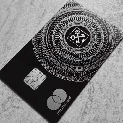 Elite Goldman Lampe black metal card with intricate engraved detailing for luxury branding