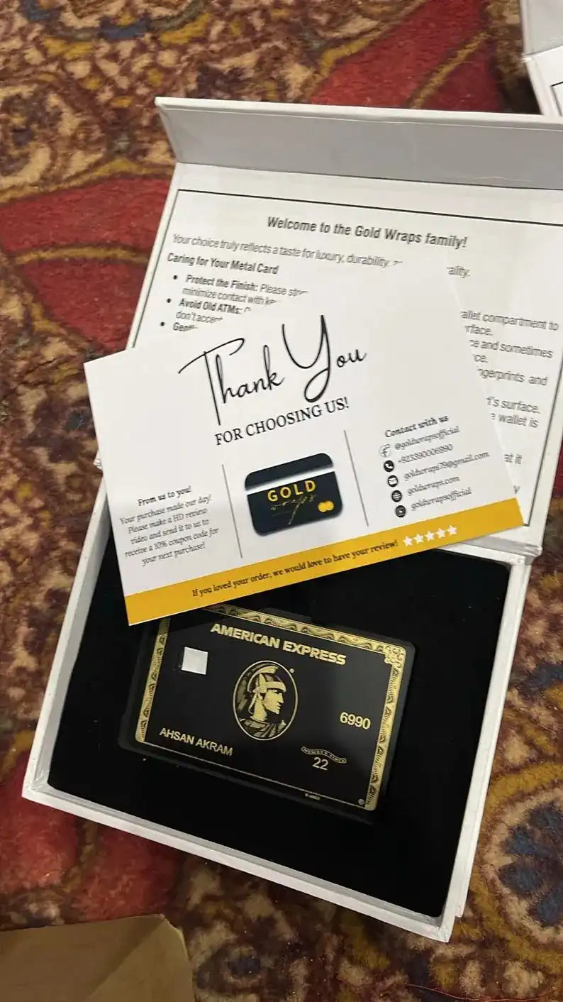 Luxury metal American Express card in gift box with thank you note on patterned fabric